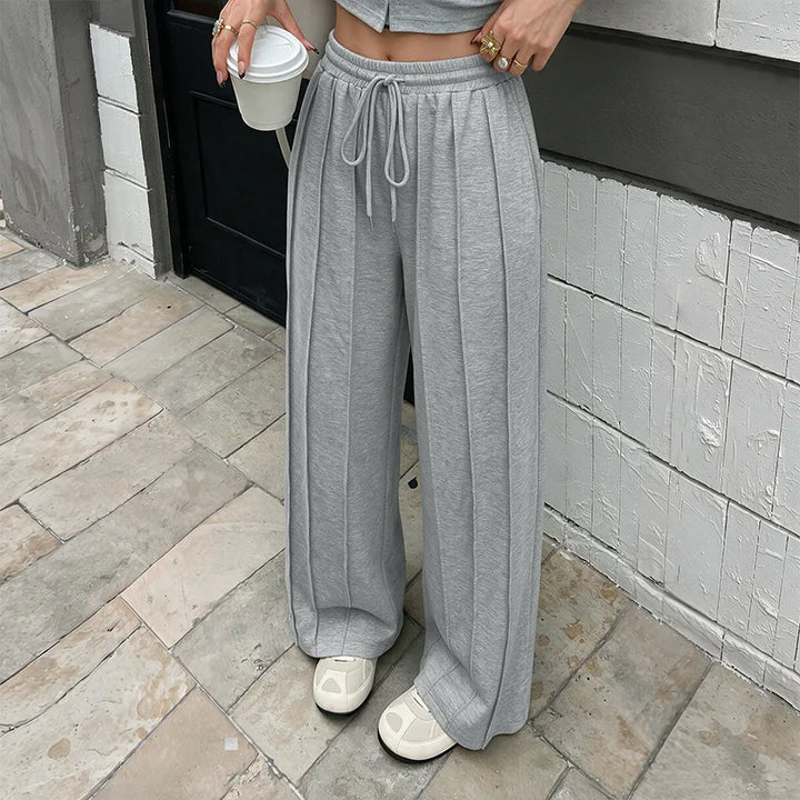 KAIA | Pantalón jogger plisado de pierna ancha