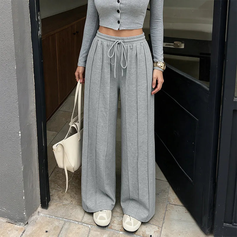 KAIA | Pantalón jogger plisado de pierna ancha