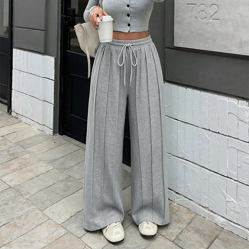 KAIA | Pantalón jogger plisado de pierna ancha